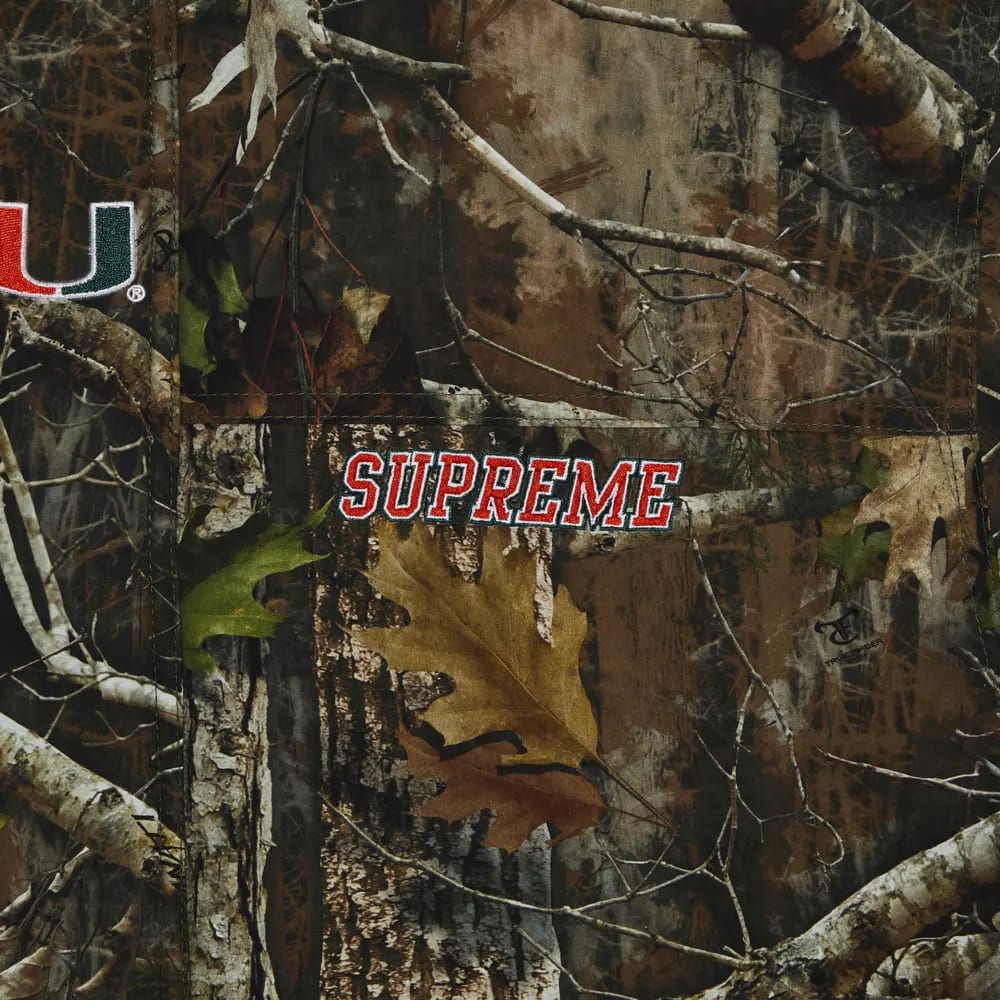 Supreme Mitchell & Ness NCAA Hooded Stadium Jacket Woodland Camo